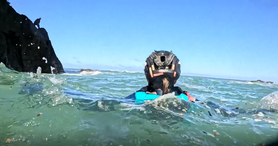 Racer swimming in the ocean, seen from water level