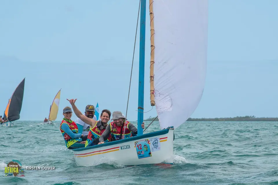 Racers sailing a traditional wooden boat at the Expedition Africa race start